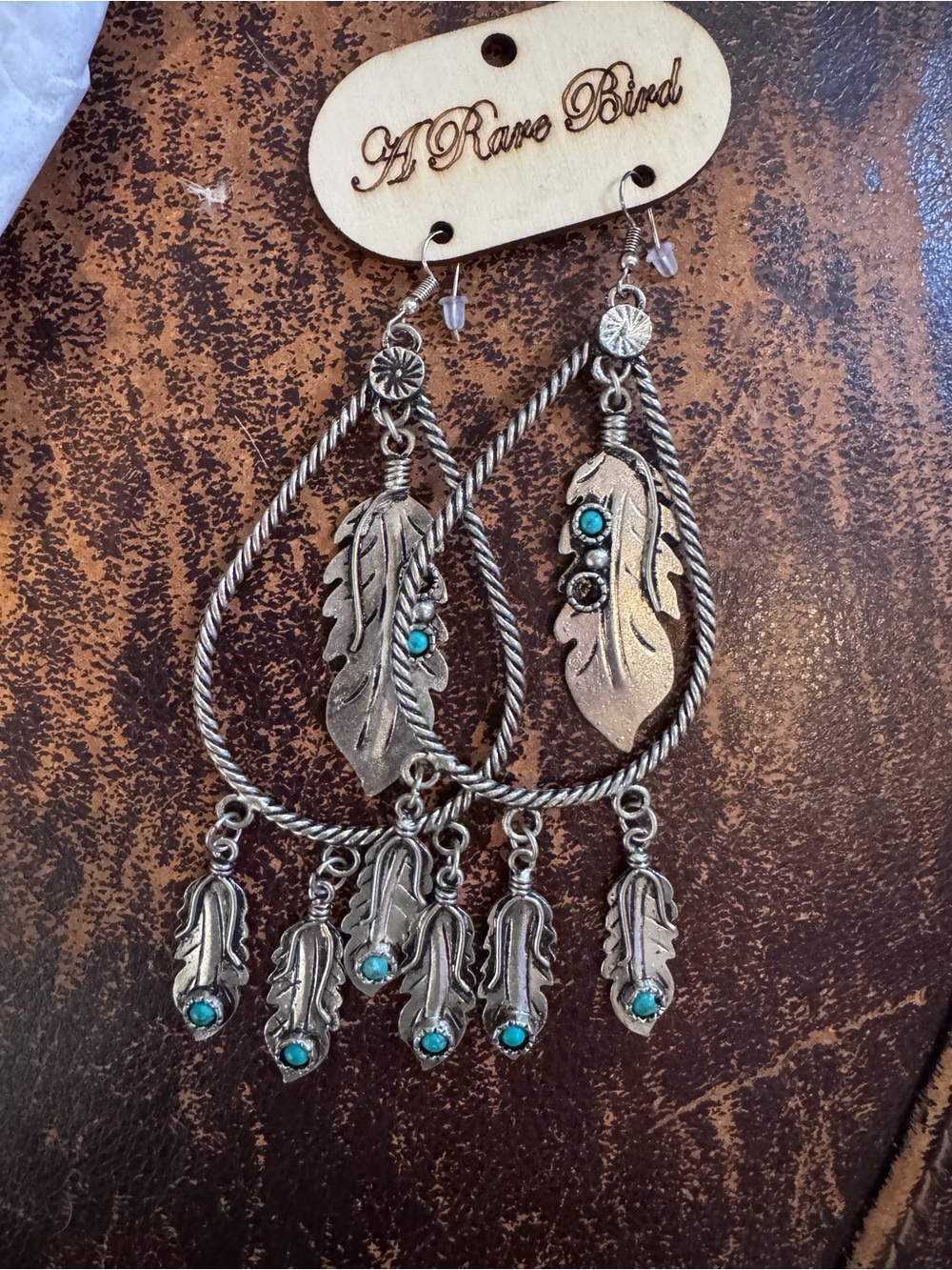 A Rare Bird Silver Feather Hoop Earrings with Turquoise Accents